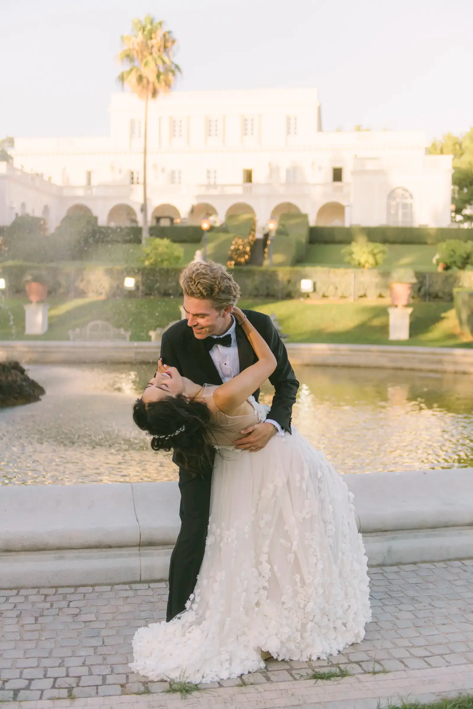 Pre-wedding couple on the Amalfi Coast cliffside at sunset
