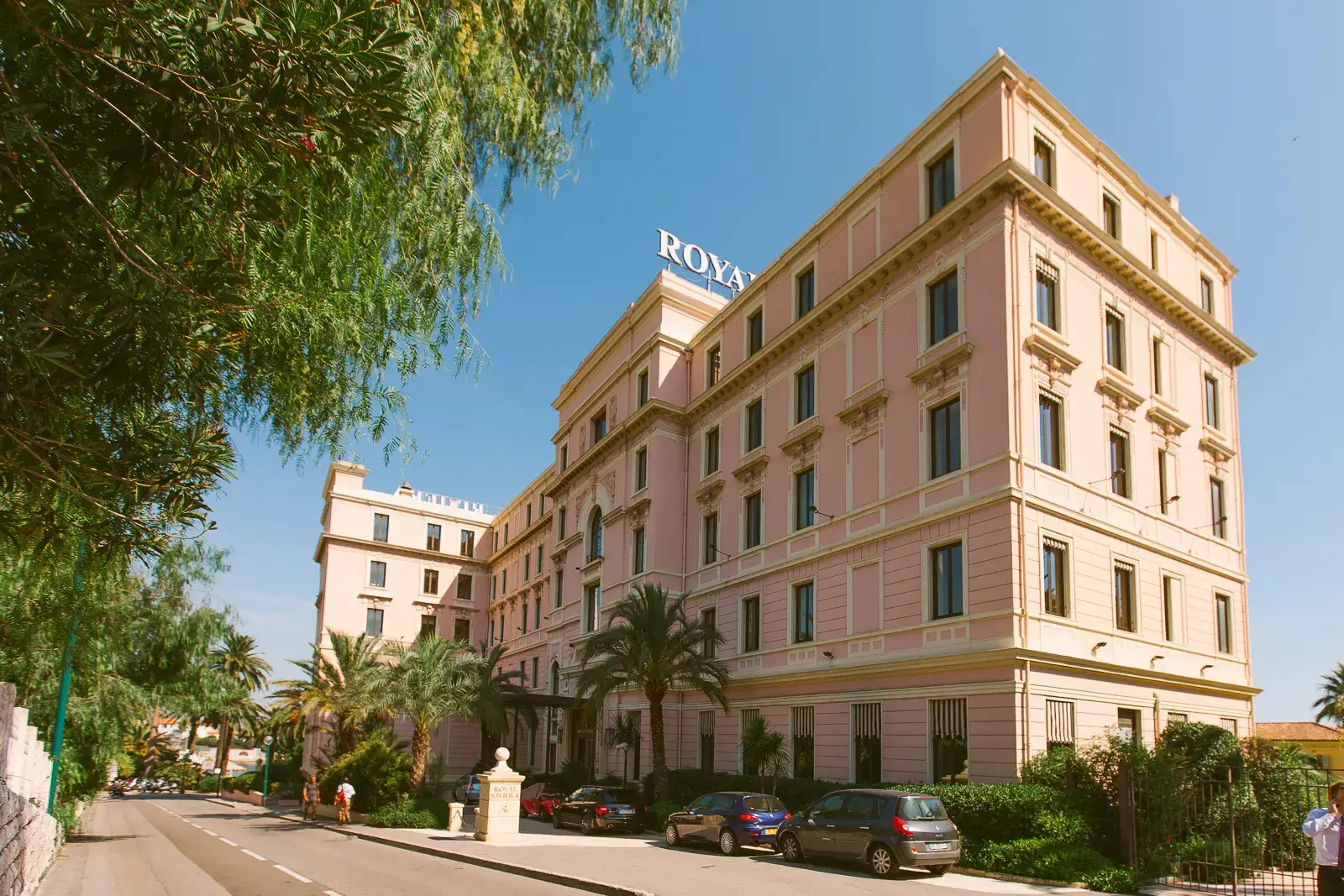 Wedding couple walking along the beachfront by the Royal Riviera Hotel in Saint-Jean-Cap-Ferrat