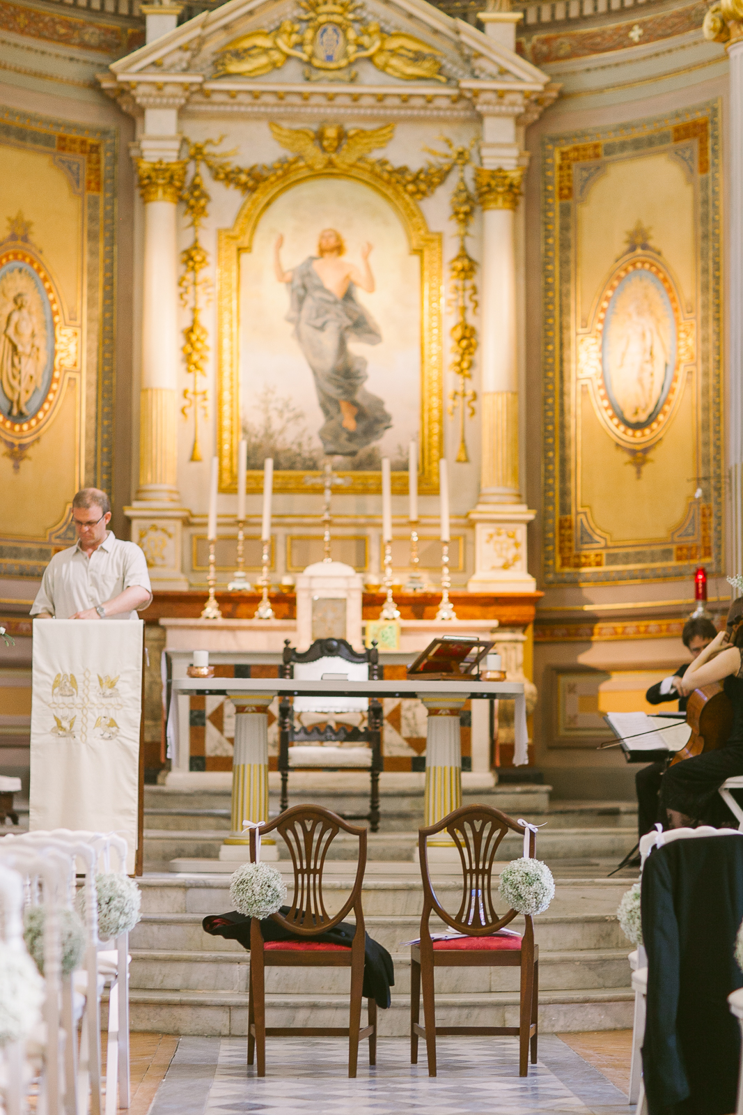 Bride arriving at St Michael’s Anglican church in Beaulieu-sur-Mer with guests waiting near the entrance.