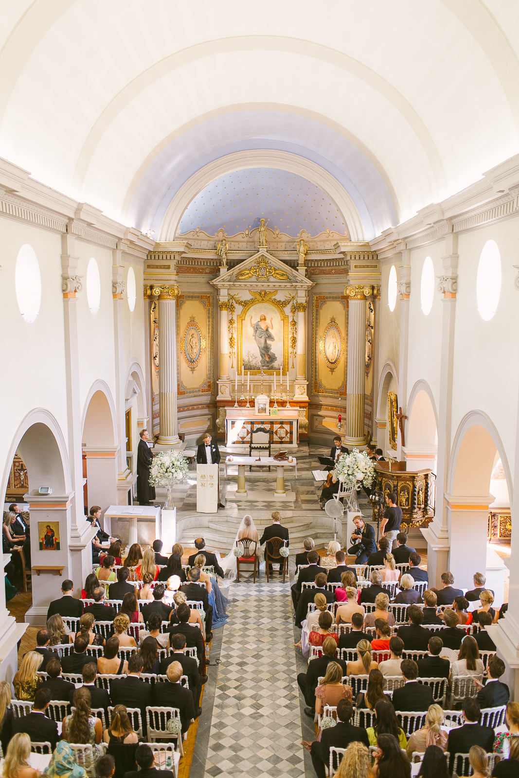Couple embracing outside St Michael’s Anglican church in Beaulieu-sur-Mer after the ceremony.