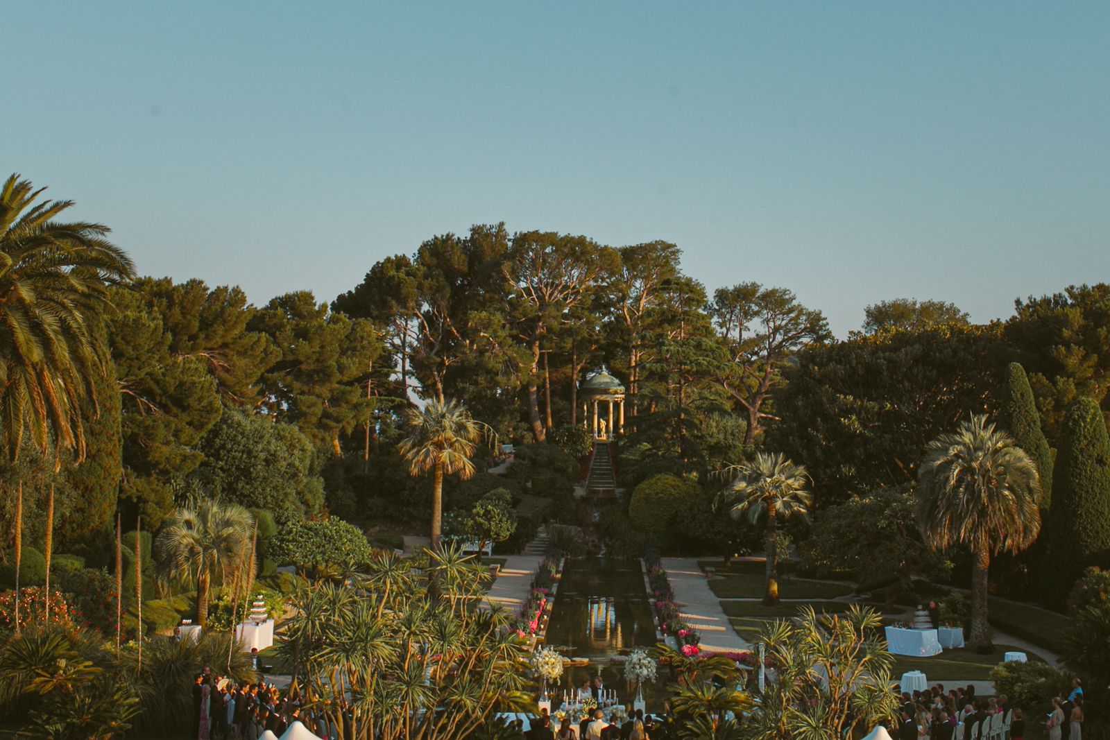 Wedding speech being given outdoors at Villa Ephrussi with the gardens as a backdrop.
