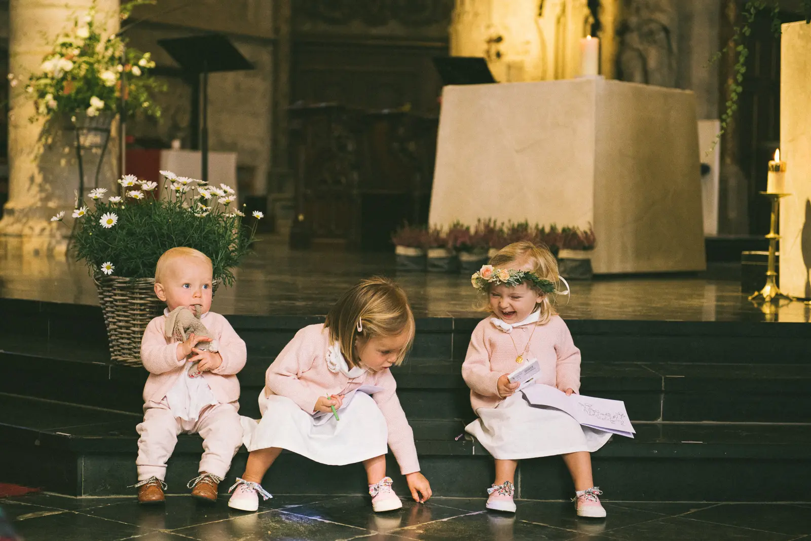 wedding ceremony in Old Lille Church , three kids sitting on the altar, epic funny wedding photo