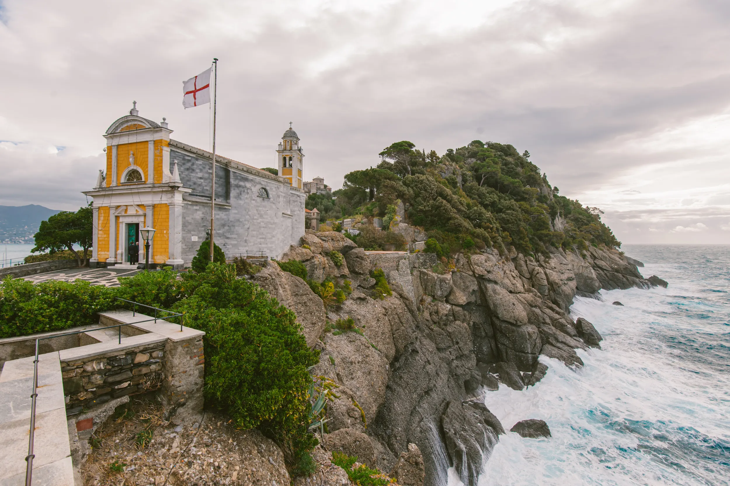 San Giorgio Church in Portofino on the rocky coastline above the sea