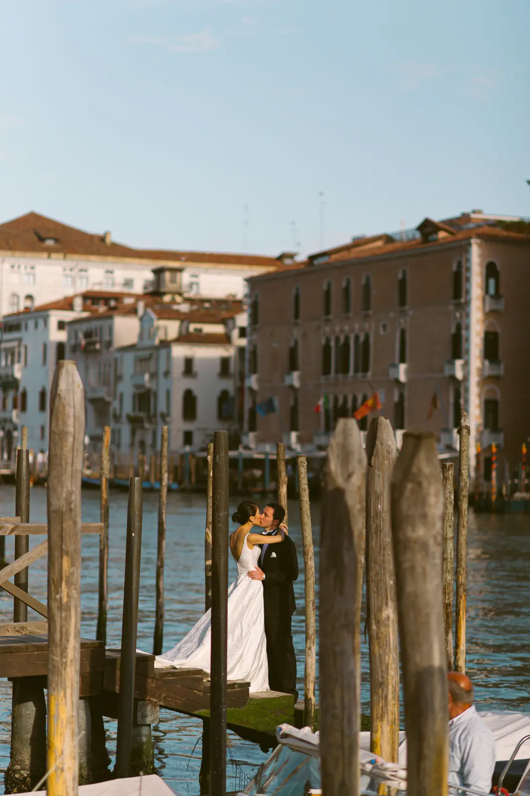 Bride and groom portrait by the Grand Canal during a Venice palazzo wedding