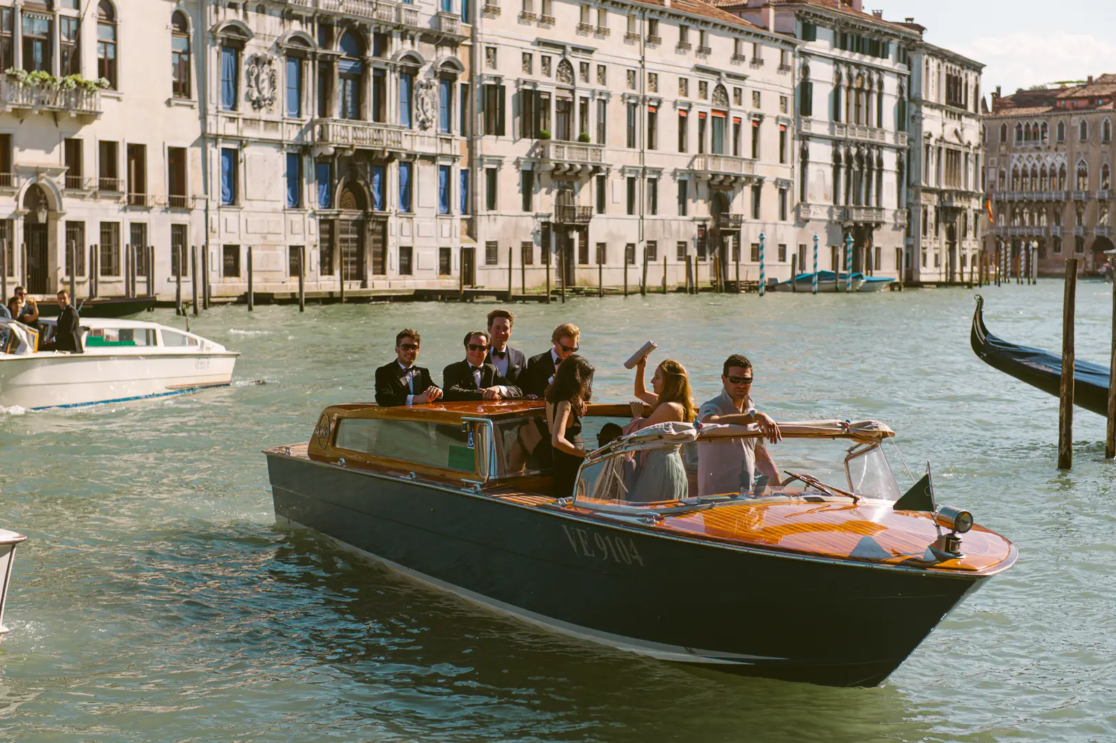 wedding guest arriving to wedding at Palazzo with water taxi